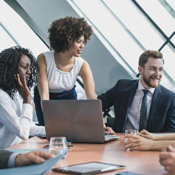 Patelco Home Loan Consultants seated around a conference table